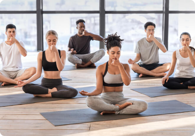 YogaFit Level One YTT students practicing pranayama during yoga teacher training