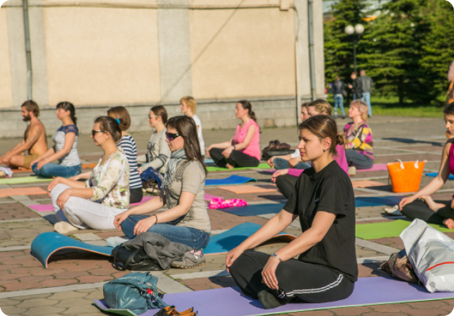 YogaFit Mind Body Fitness Conference participants practicing yoga and meditation
